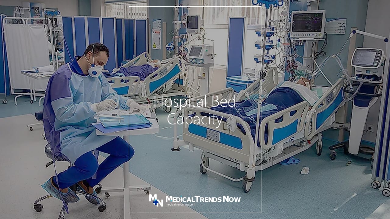 hospital bed with medical equipment and a nurse