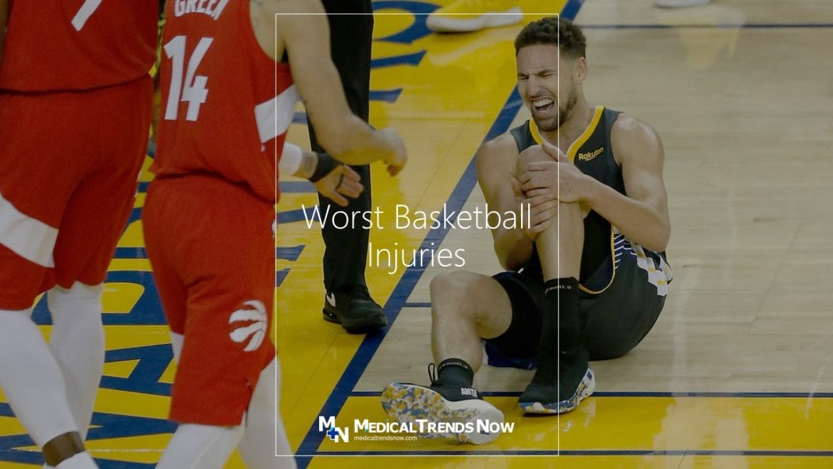 Sports player in pain at the court - painful injury in basketball