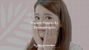 Filipina touches her face and want to prevent pimples from popping