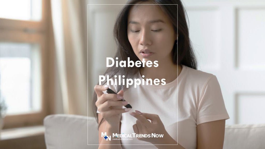 Filipino diagnosing her health by puncturing her hand if she has diabetes in the Philippines