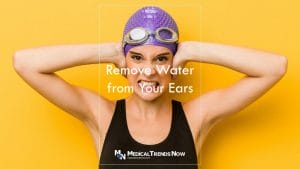removing water from your ears after swimming