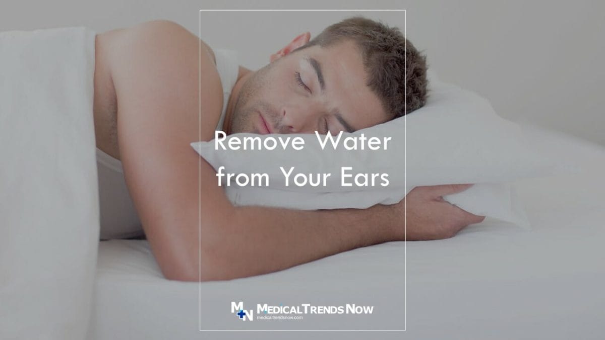 take a nap sideway to remove water from ears