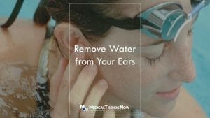 jiggling your ears to remove water