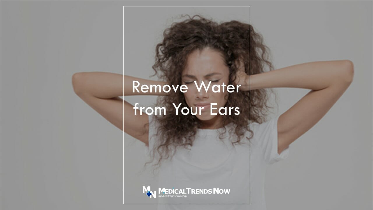 palm of your hands to suck out the water from your ears