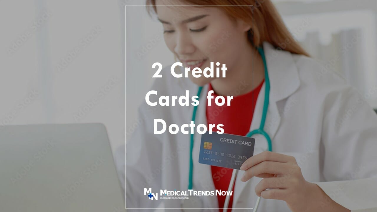 female doctor in the philippines holding a credit card while online shopping