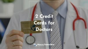 Filipino doctor holding a credit card